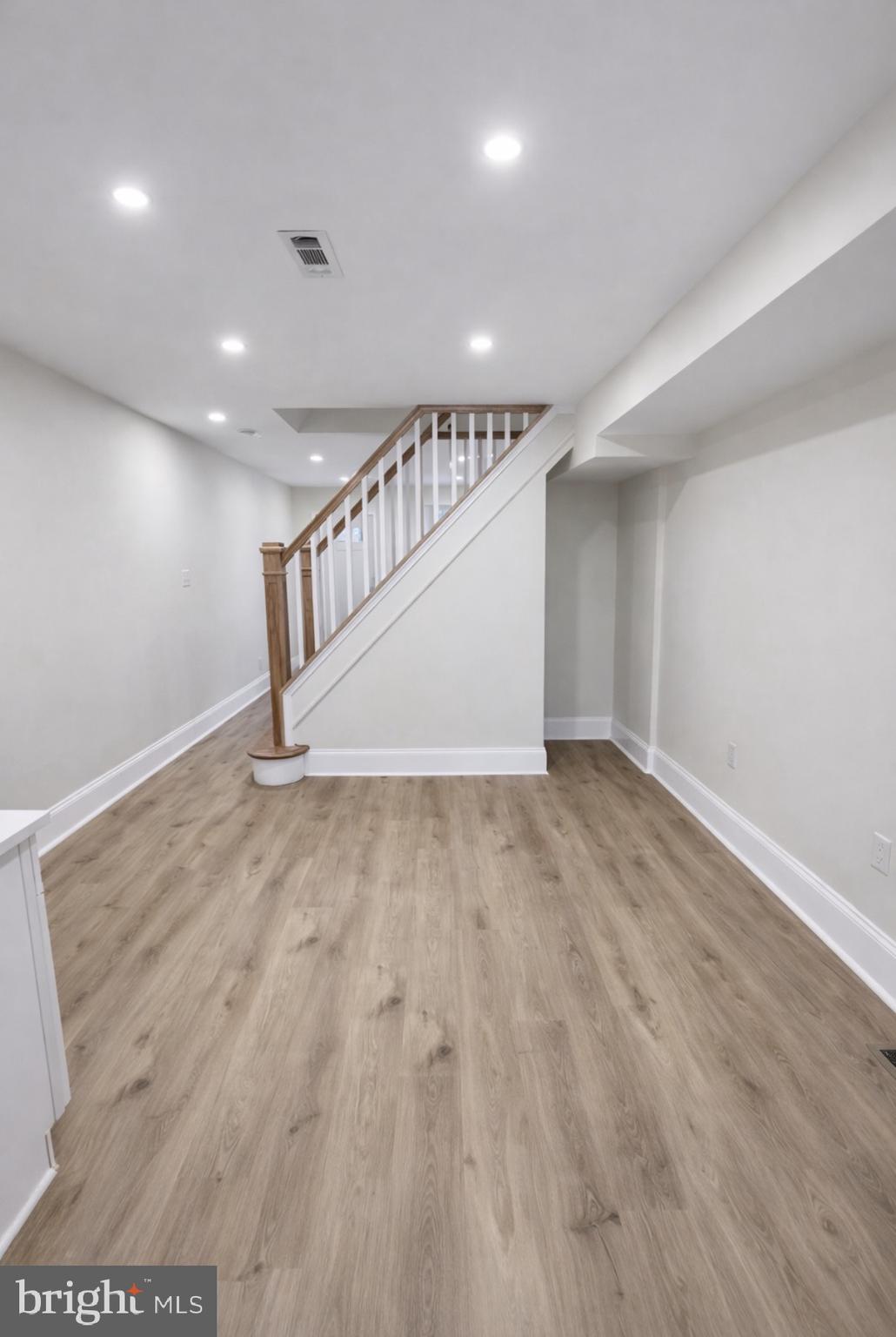 22 Maple Street Conshohocken, PA 19428 - Photo 5 of 22 an empty room with wooden floor and windows