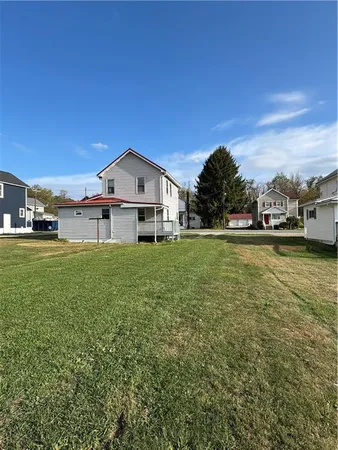 a view of a house with a big yard