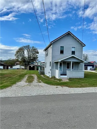 a view of house with backyard and entertaining space