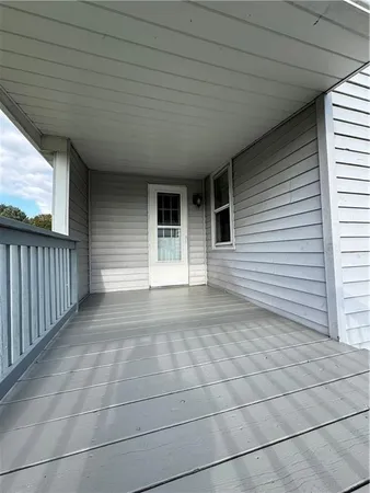 a view of a porch of a house