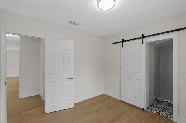 a bathroom with a shower a toilet and sink