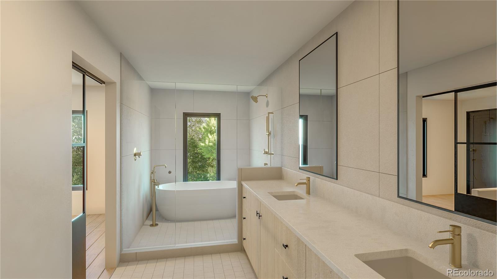 3908 Upham Street Wheat Ridge, CO 80033 - Photo 5 of 35 a en suite bathroom with a double vanity sink a mirror and a bathtub