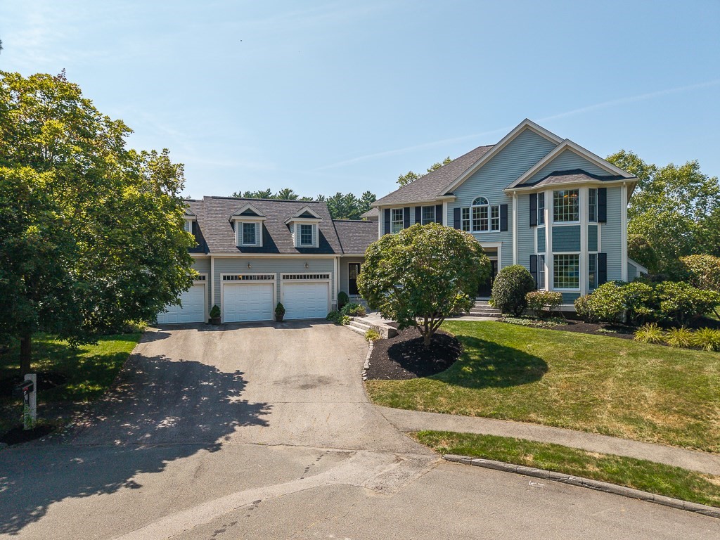 17 Patton Drive Hamilton, MA 01982 - Photo 1 of 37 a front view of a house with garden