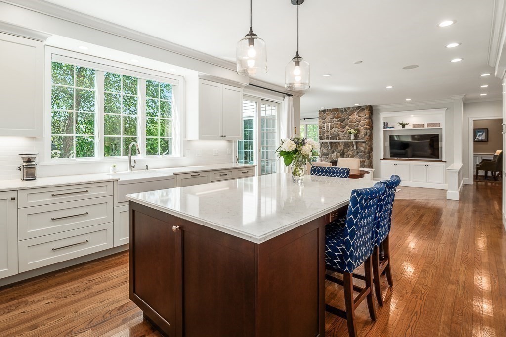 17 Patton Drive Hamilton, MA 01982 - Photo 11 of 37 a kitchen with a table chairs and flat screen tv