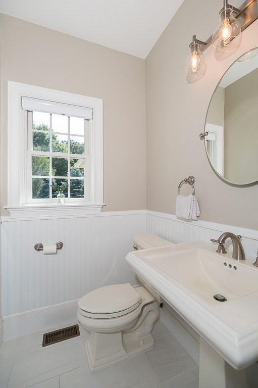 17 Patton Drive Hamilton, MA 01982 - Photo 18 of 37 a bathroom with a sink a toilet and a mirror