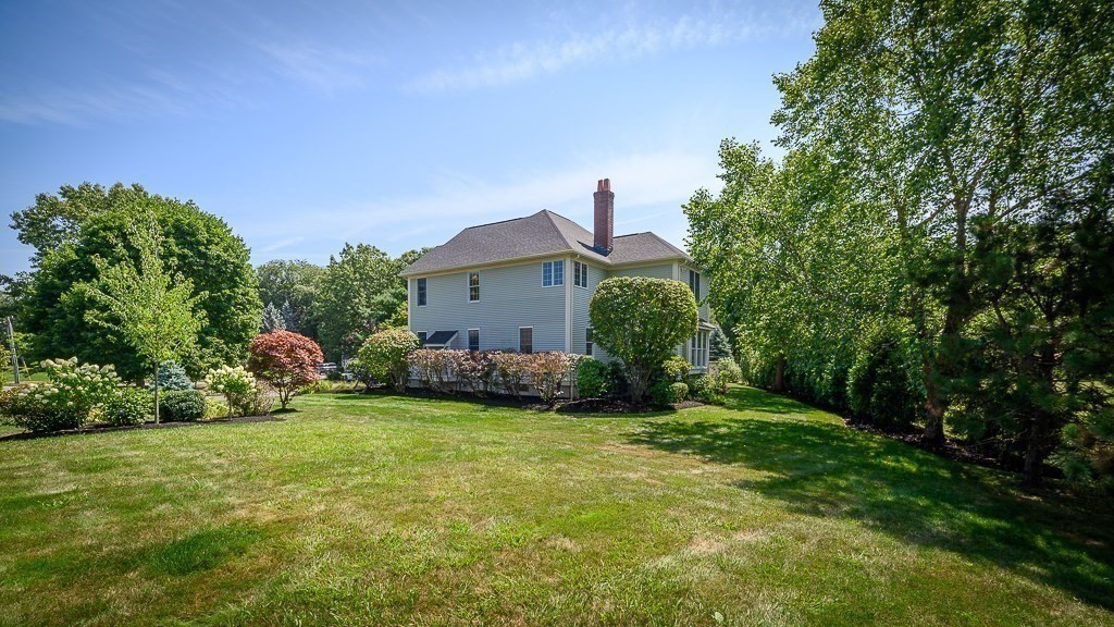 17 Patton Drive Hamilton, MA 01982 - Photo 2 of 37 a view of a house with a yard and sitting area