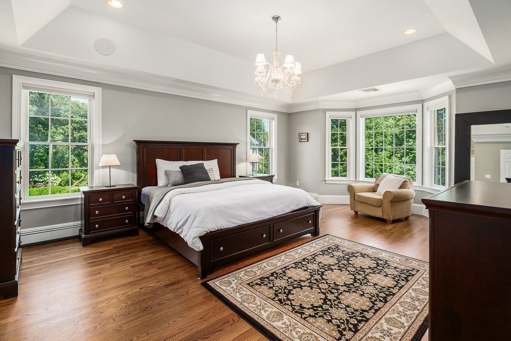 17 Patton Drive Hamilton, MA 01982 - Photo 22 of 37 a bedroom with a large bed and a couch