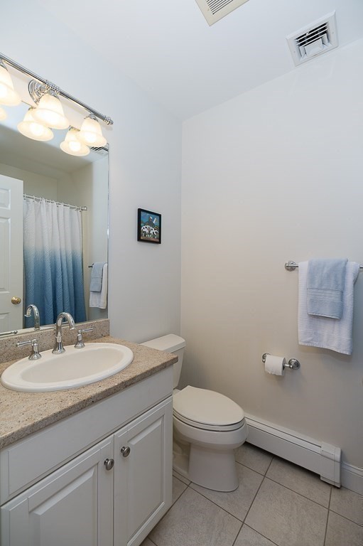 17 Patton Drive Hamilton, MA 01982 - Photo 26 of 37 a bathroom with a toilet a sink and mirror