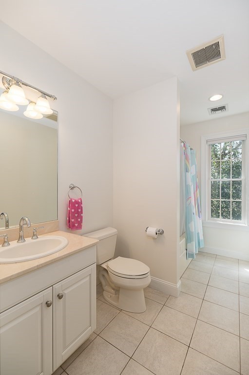 17 Patton Drive Hamilton, MA 01982 - Photo 28 of 37 a bathroom with a sink a toilet and a mirror