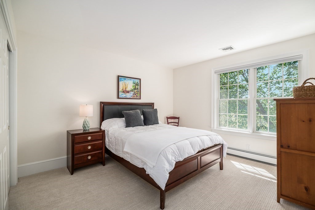 17 Patton Drive Hamilton, MA 01982 - Photo 29 of 37 a bedroom with a bed and a window