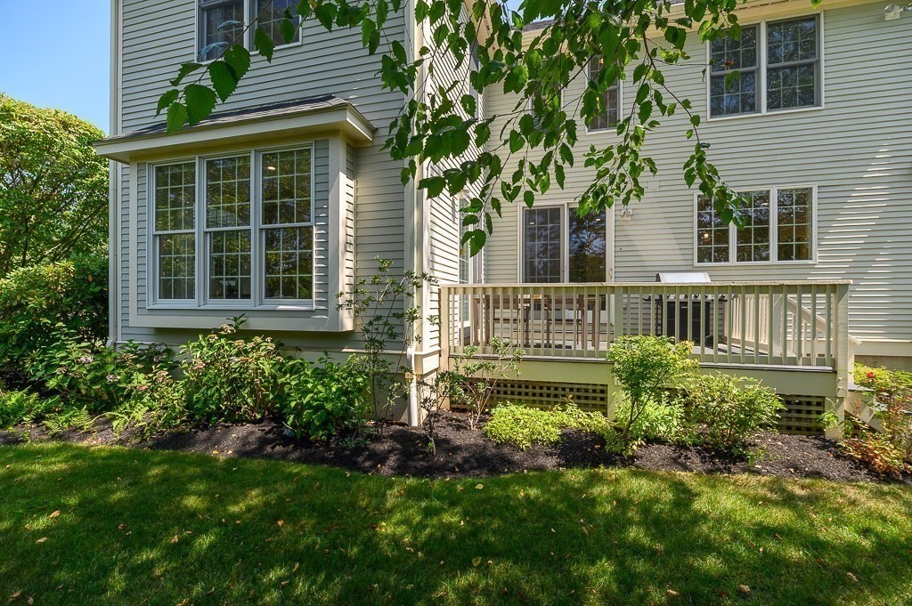 17 Patton Drive Hamilton, MA 01982 - Photo 33 of 37 a view of a house with a flower garden