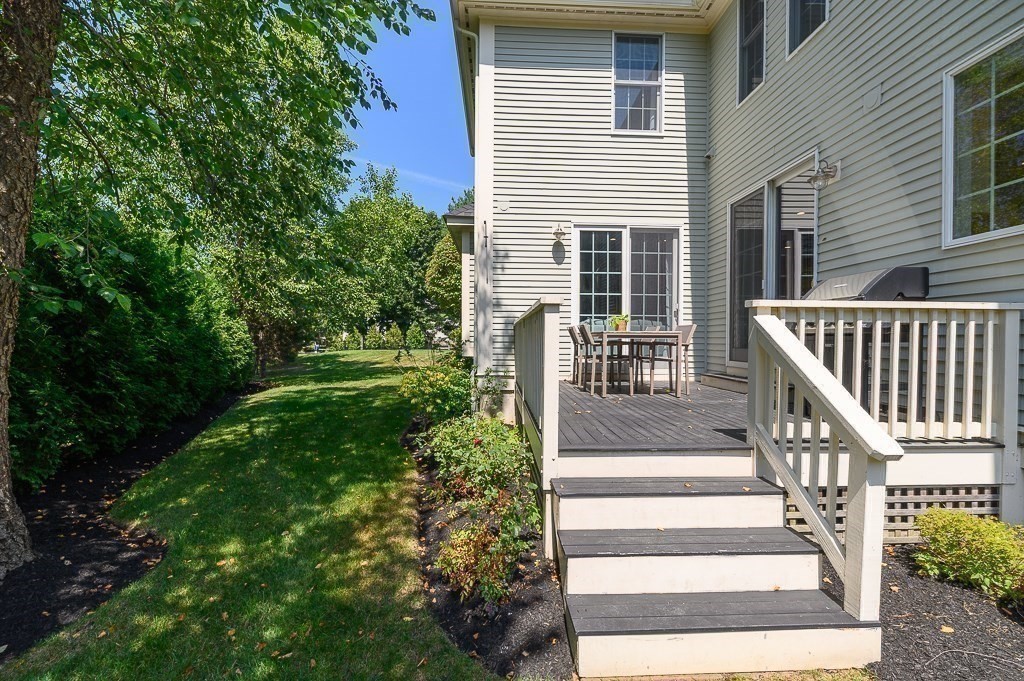 17 Patton Drive Hamilton, MA 01982 - Photo 34 of 37 a view of backyard with deck and outdoor seating