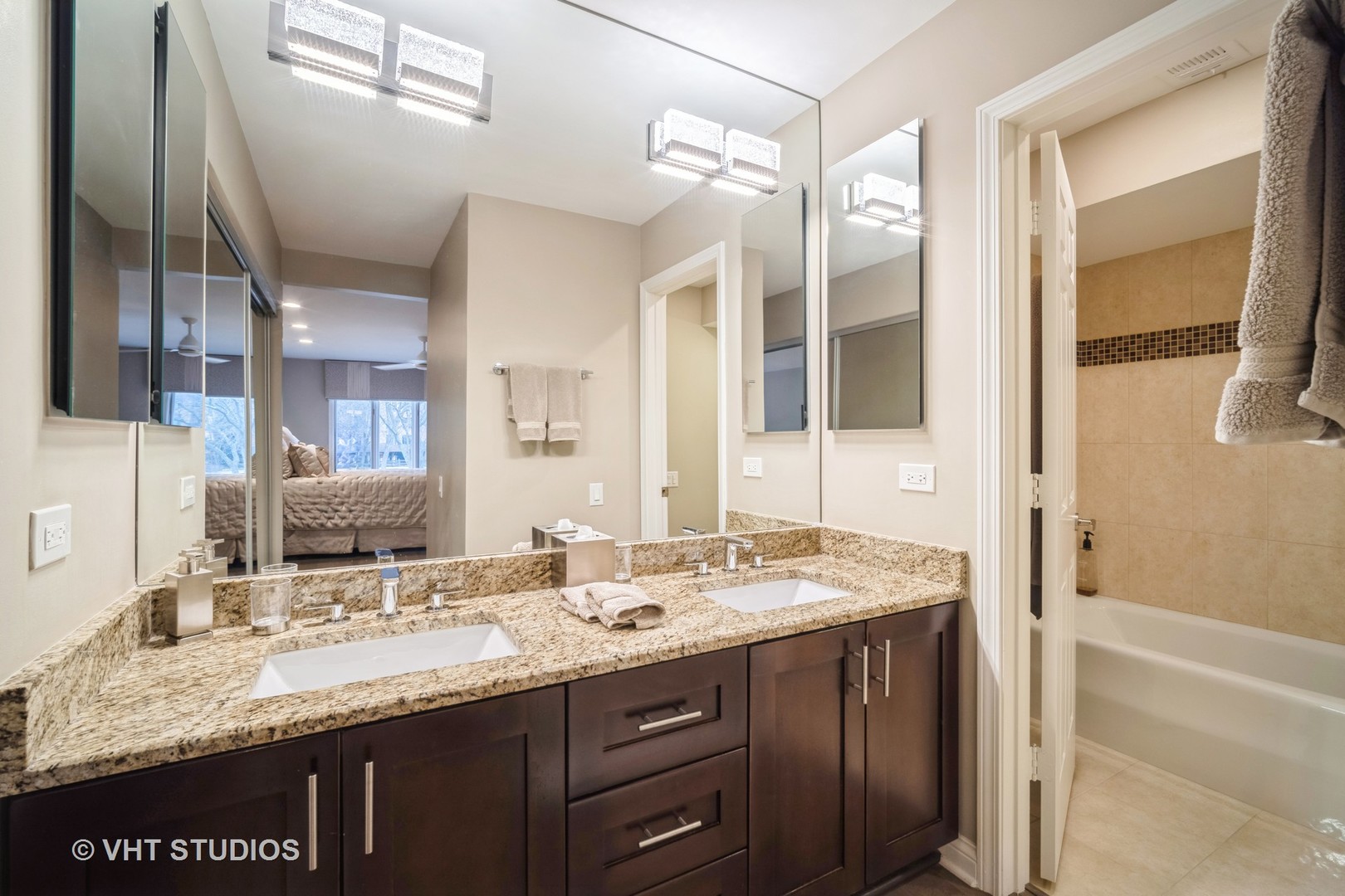 1831 Mission Hills Road, Unit 112 Northbrook, IL 60062 - Photo 13 of 17 a bathroom with a granite countertop sink mirror and double