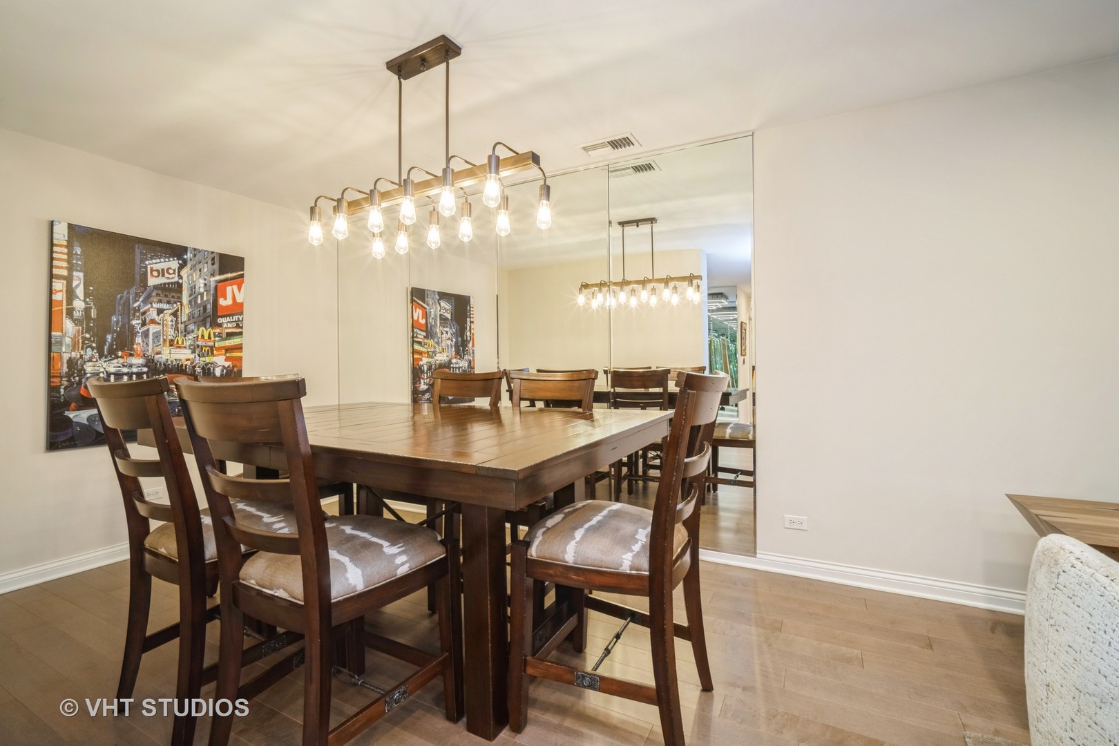 1831 Mission Hills Road, Unit 112 Northbrook, IL 60062 - Photo 4 of 17 a view of a dining room with furniture and chandelier