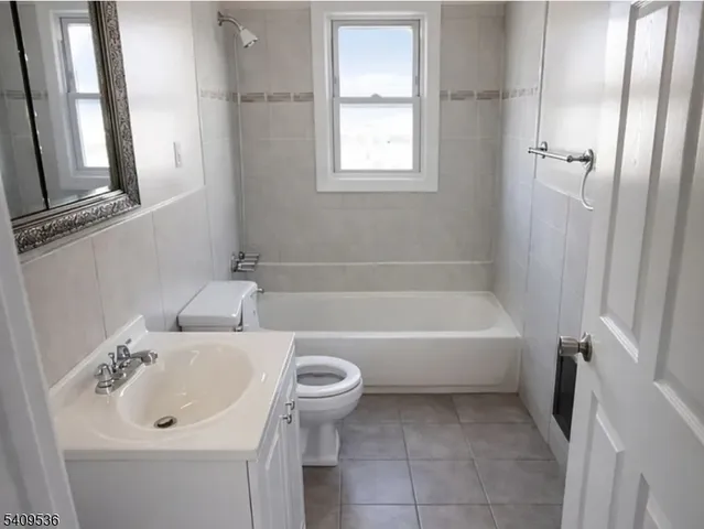 a bathroom with a sink a toilet and a bathtub