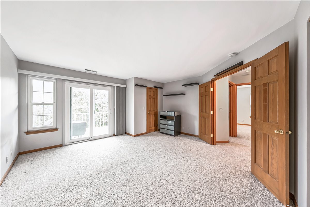 3 Taylor Court, Unit B Streamwood, IL 60107 - Photo 14 of 30 a view of an empty room with a window