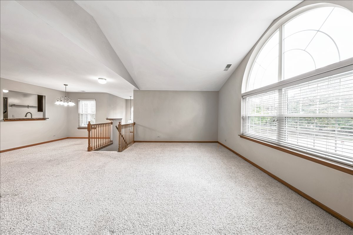 3 Taylor Court, Unit B Streamwood, IL 60107 - Photo 9 of 30 a view of an empty room with a window
