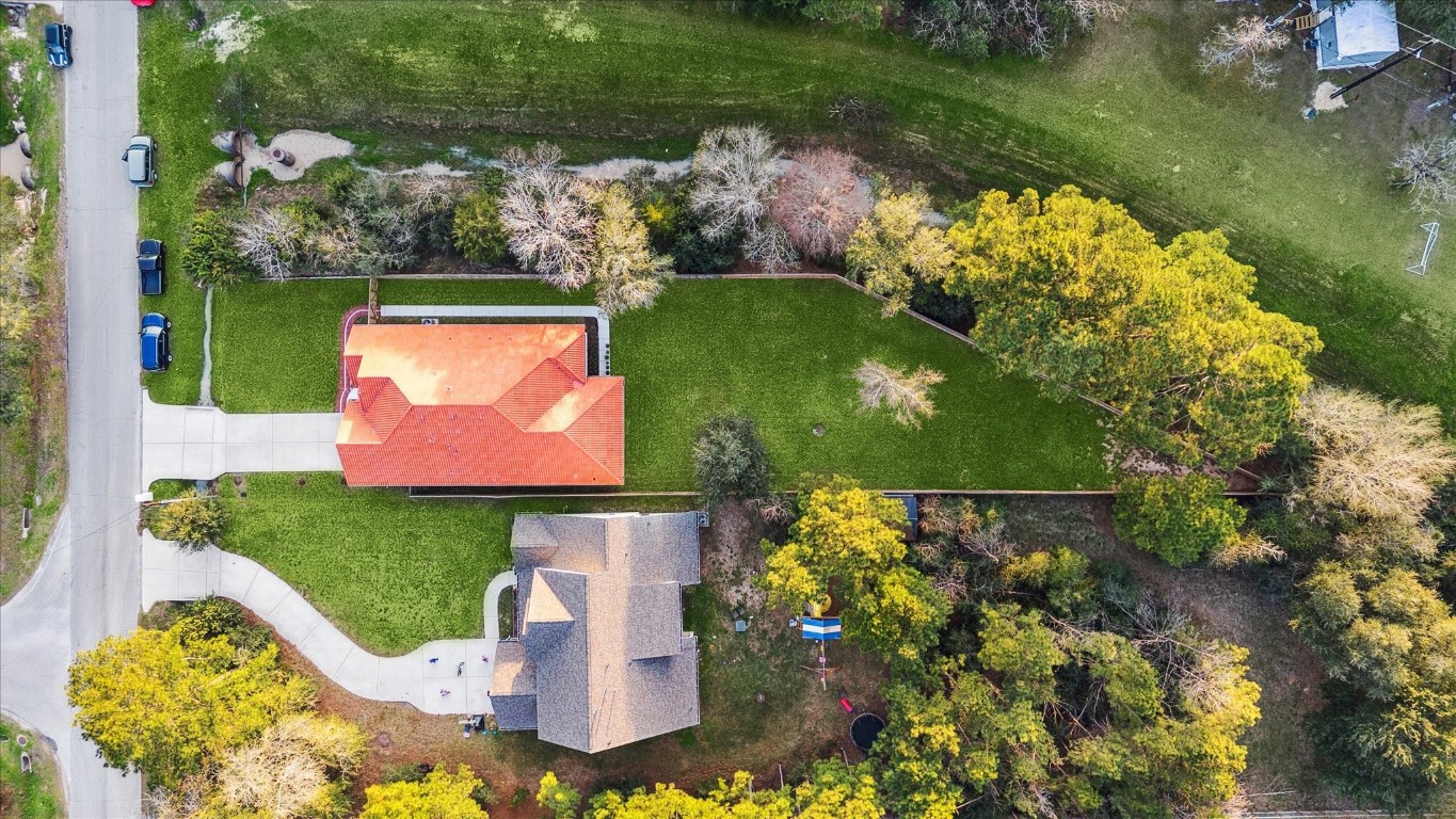 532 Carrell Street Tomball, TX 77375 - Photo 26 of 28 Aerial view showcasing the spacious lot and the detailed tile roof, which enhances the home’s overall presence and architectural character.
