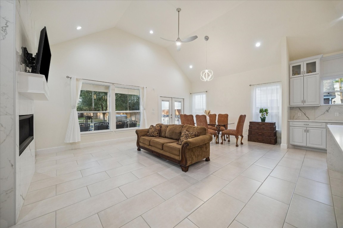 532 Carrell Street Tomball, TX 77375 - Photo 5 of 28 An alternate view of the living space showcases its spacious and elegant layout, seamlessly connecting the home’s main living areas. Natural light creates a serene atmosphere, complemented by energy-efficient LED lighting designed for everyday comfort and efficiency.