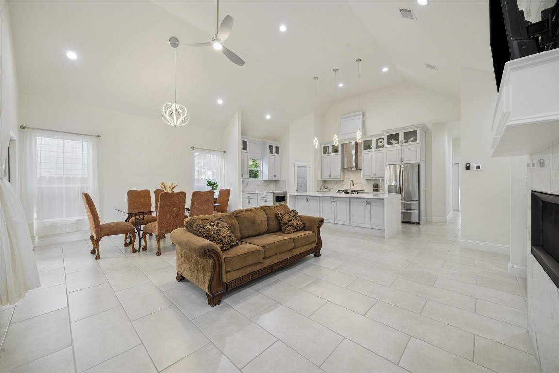 532 Carrell Street Tomball, TX 77375 - Photo 7 of 28 You’ll love the high ceilings in this living space, creating a sense of openness, serenity, and comfort. Energy-efficient LED lighting, generous space, a ceiling fan, and a beautiful light fixture further enhance the room, reflecting a home that is truly moving-in ready.