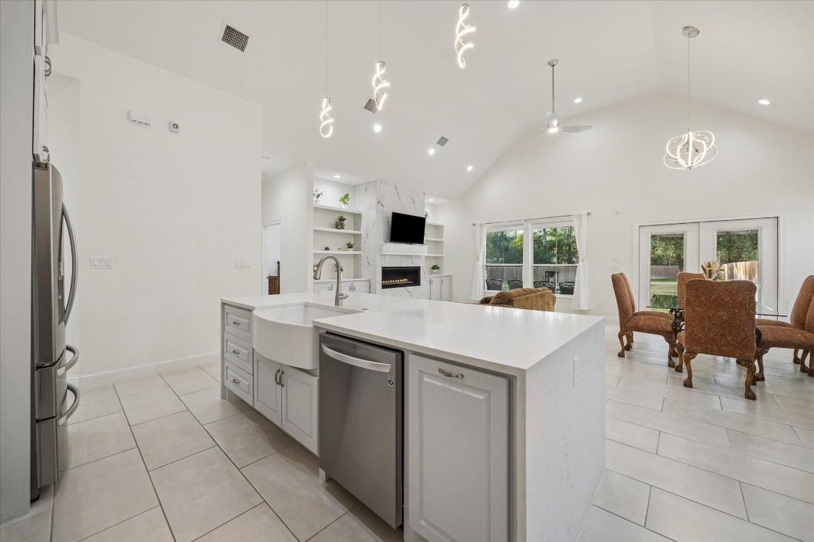 532 Carrell Street Tomball, TX 77375 - Photo 10 of 28 This view highlights the spacious sink, ideal for busy households. Light, carefully selected tones throughout the kitchen create a sense of elegance and calm, while abundant natural light enhances the bright and inviting atmosphere.