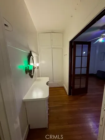 a room with a dresser and a mirror