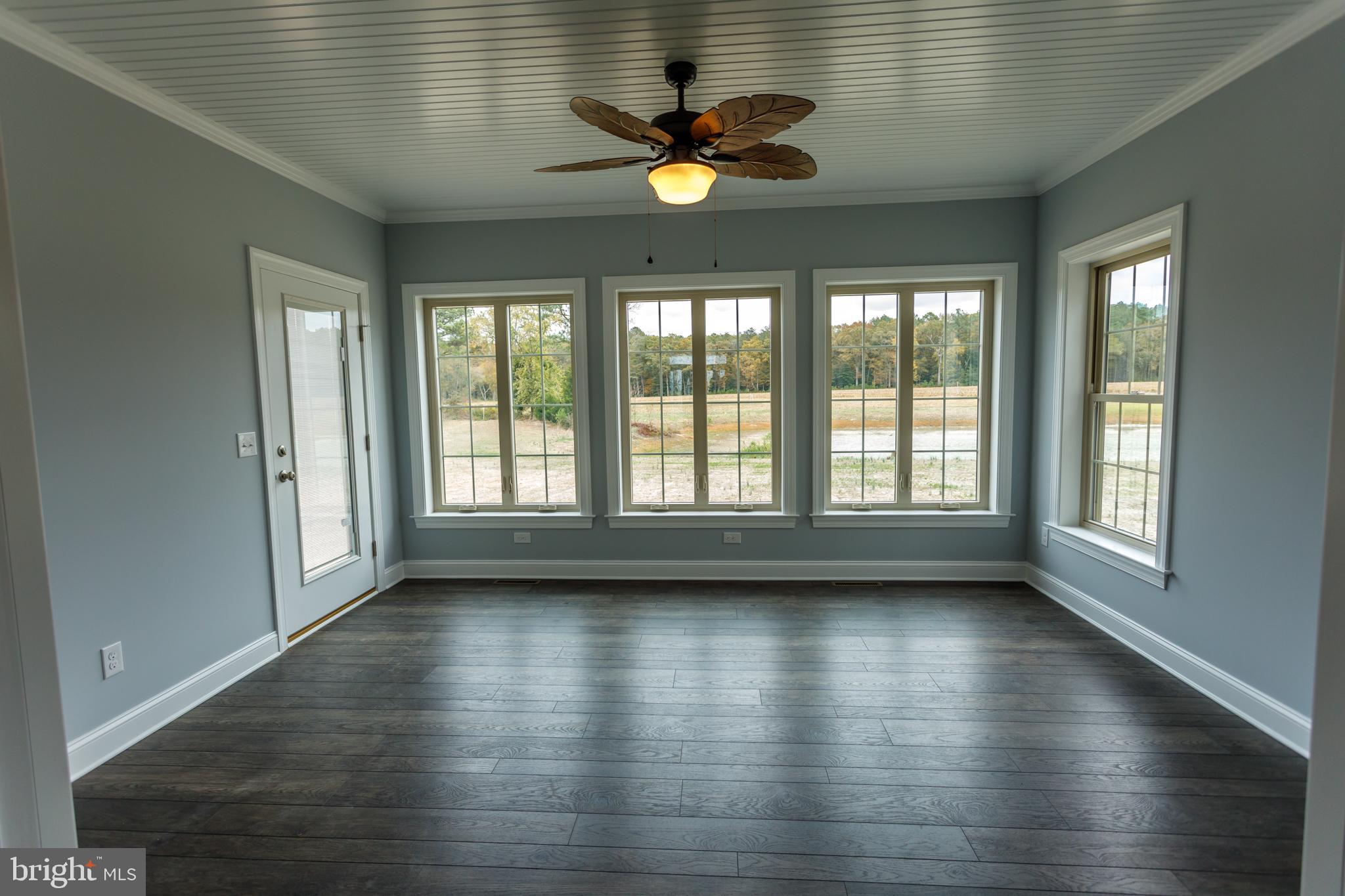 20695 State Forest Road Georgetown, DE 19947 - Photo 24 of 60 Sunroom has great views of the pond and trees