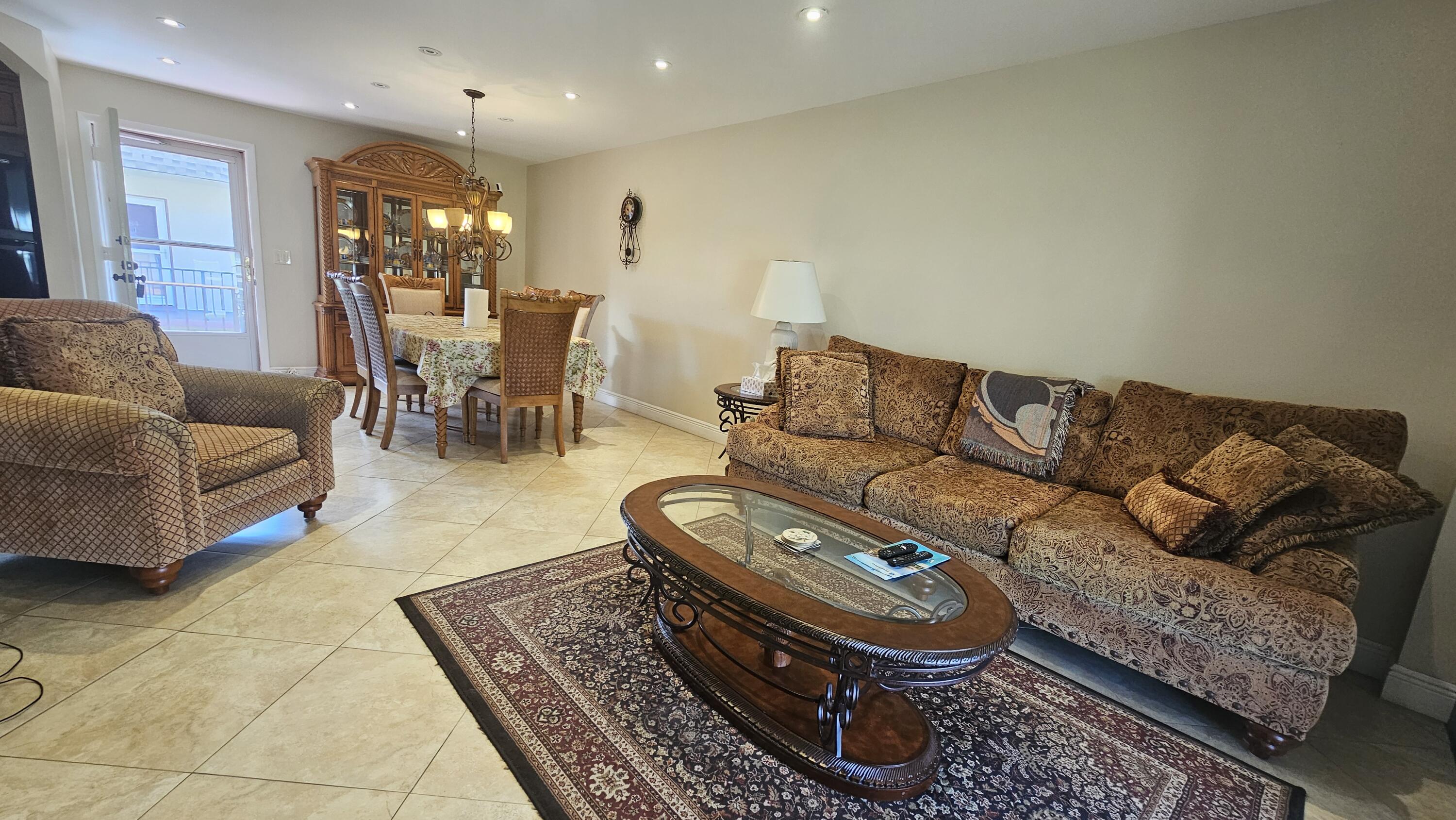 504 Davis Road, Unit 96 Palm Springs, FL 33461 - Photo 15 of 42 a living room with furniture and a rug