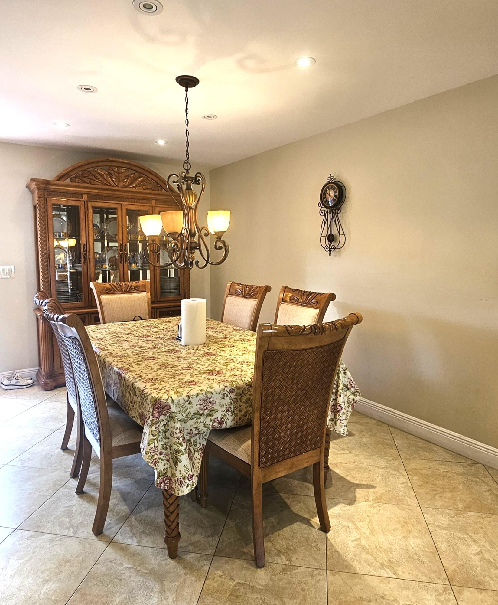 504 Davis Road, Unit 96 Palm Springs, FL 33461 - Photo 16 of 42 a dining room with a table and chairs