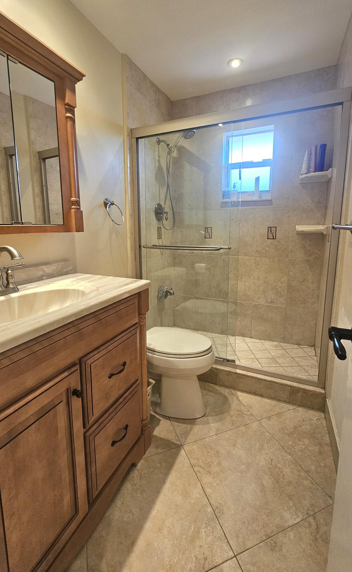 504 Davis Road, Unit 96 Palm Springs, FL 33461 - Photo 28 of 42 a bathroom with a sink a toilet and shower