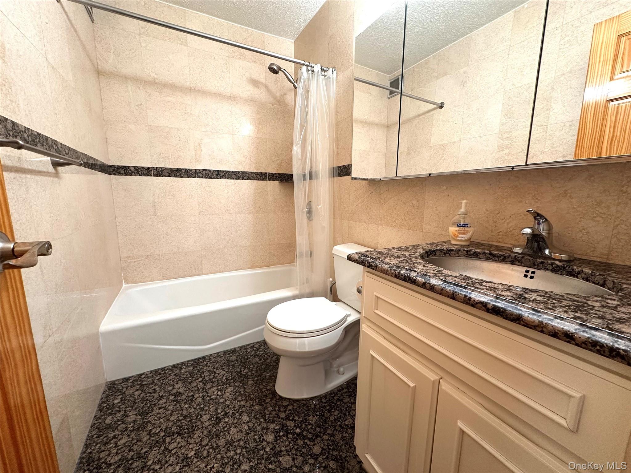 41-40 Union Street, Unit 16M Queens, NY 11355 - Photo 5 of 12 Full bathroom with granite floor and counter