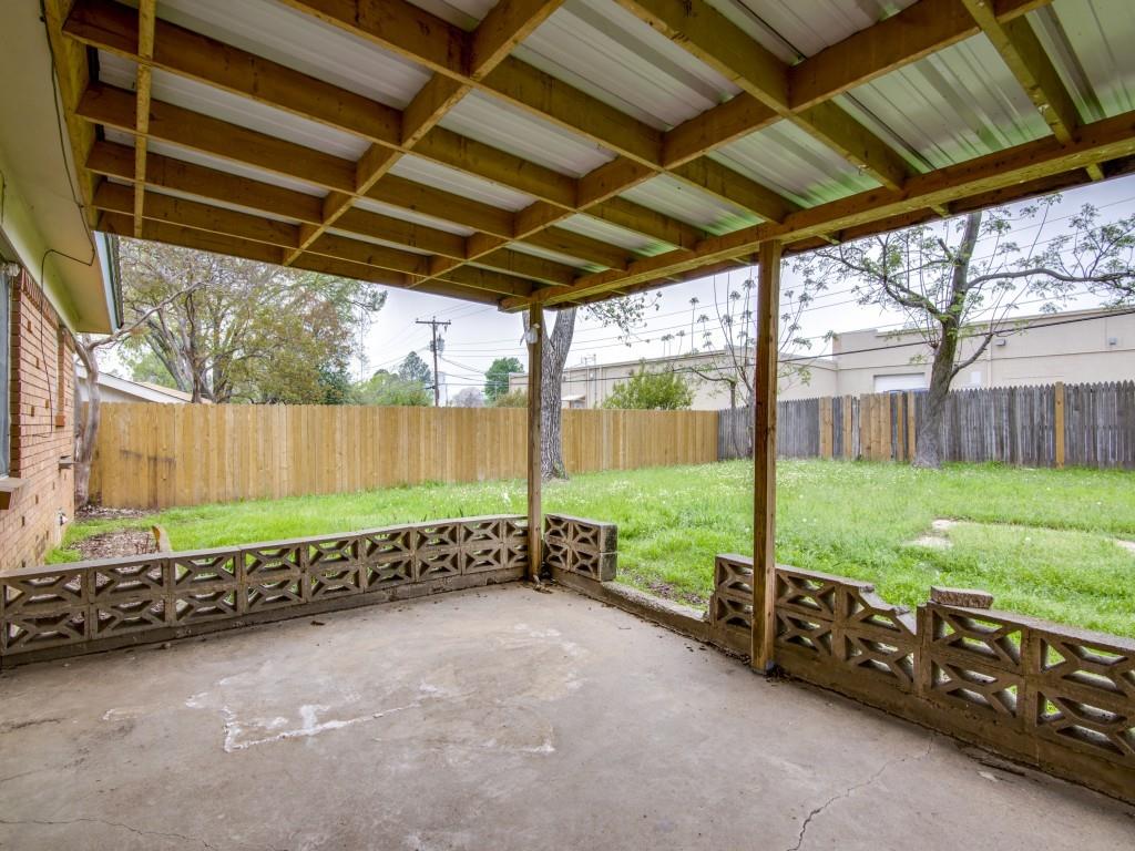420 Vicki Place Hurst, TX 76053 - Photo 11 of 12 a view of a backyard with wooden fence