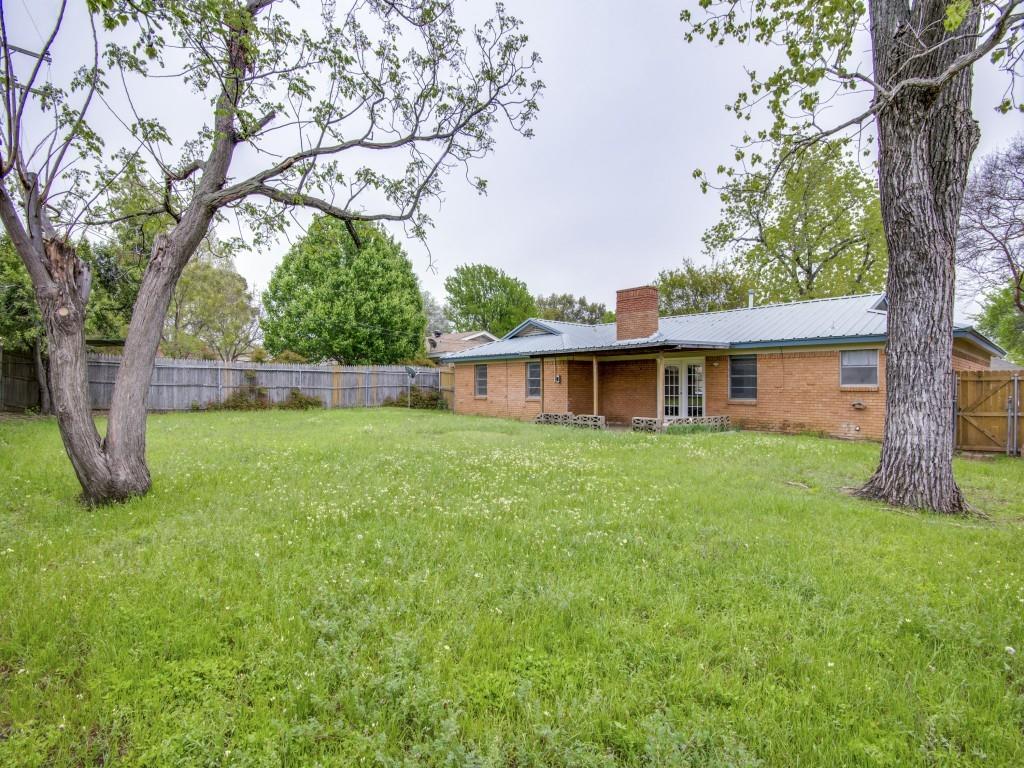 420 Vicki Place Hurst, TX 76053 - Photo 12 of 12 a view of a house with a yard and a large tree