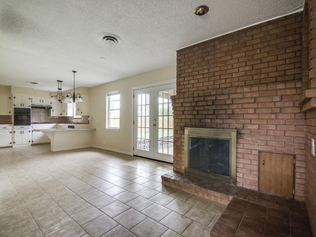 420 Vicki Place Hurst, TX 76053 - Photo 4 of 12 a view of a livingroom with a fireplace and window