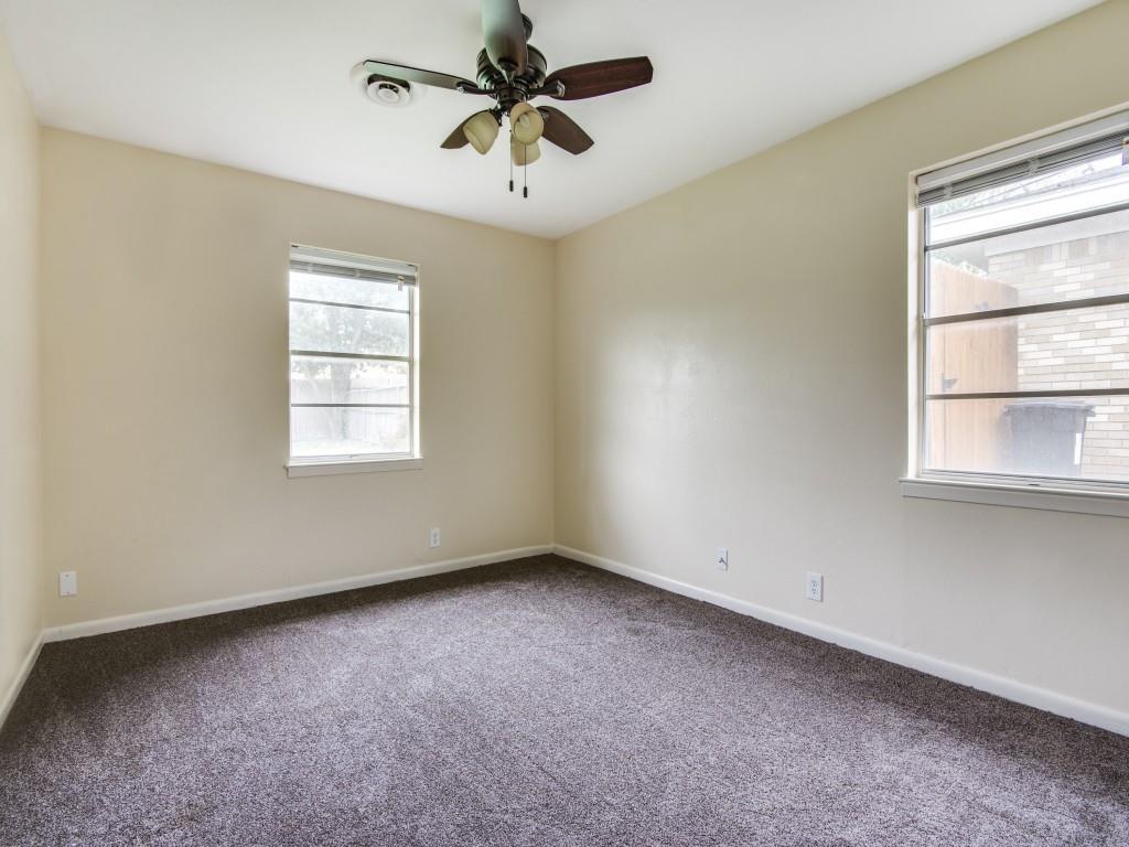 420 Vicki Place Hurst, TX 76053 - Photo 8 of 12 an empty room with windows and fan