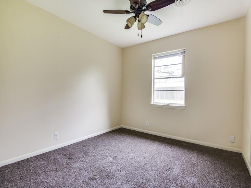 420 Vicki Place Hurst, TX 76053 - Photo 9 of 12 an empty room with a window and a fan