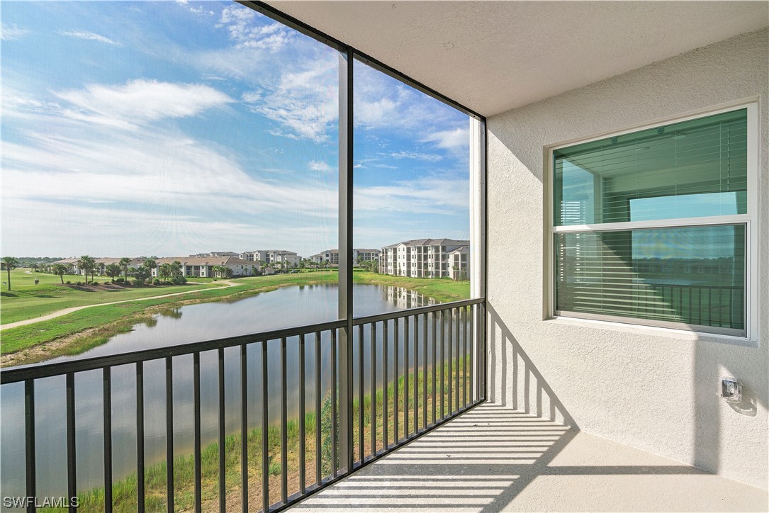 43989 Boardwalk Loop, Unit 2033 Punta Gorda, FL 33982 - Photo 14 of 36 a view of a balcony with floor to ceiling windows with wooden floor