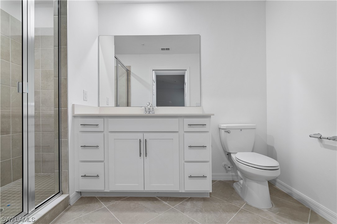 43989 Boardwalk Loop, Unit 2033 Punta Gorda, FL 33982 - Photo 16 of 36 a bathroom with a toilet and a sink