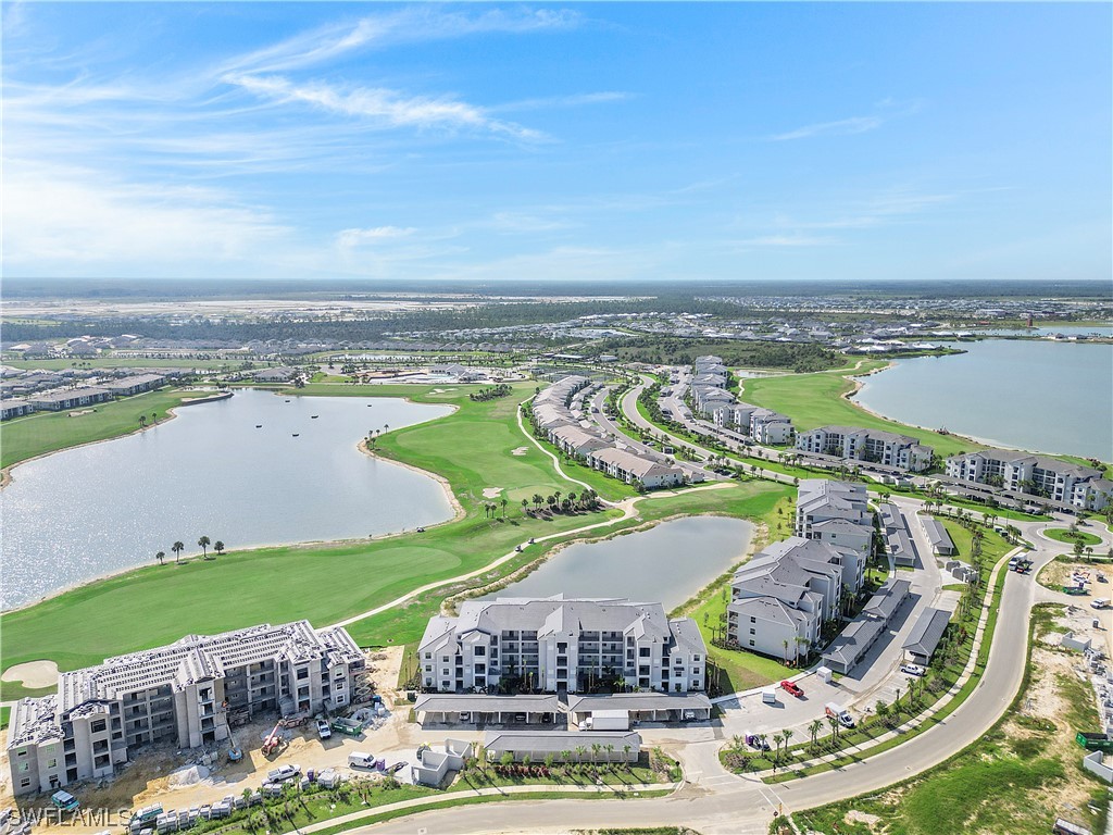 43989 Boardwalk Loop, Unit 2033 Punta Gorda, FL 33982 - Photo 2 of 36 a view of a swimming pool with a terrace