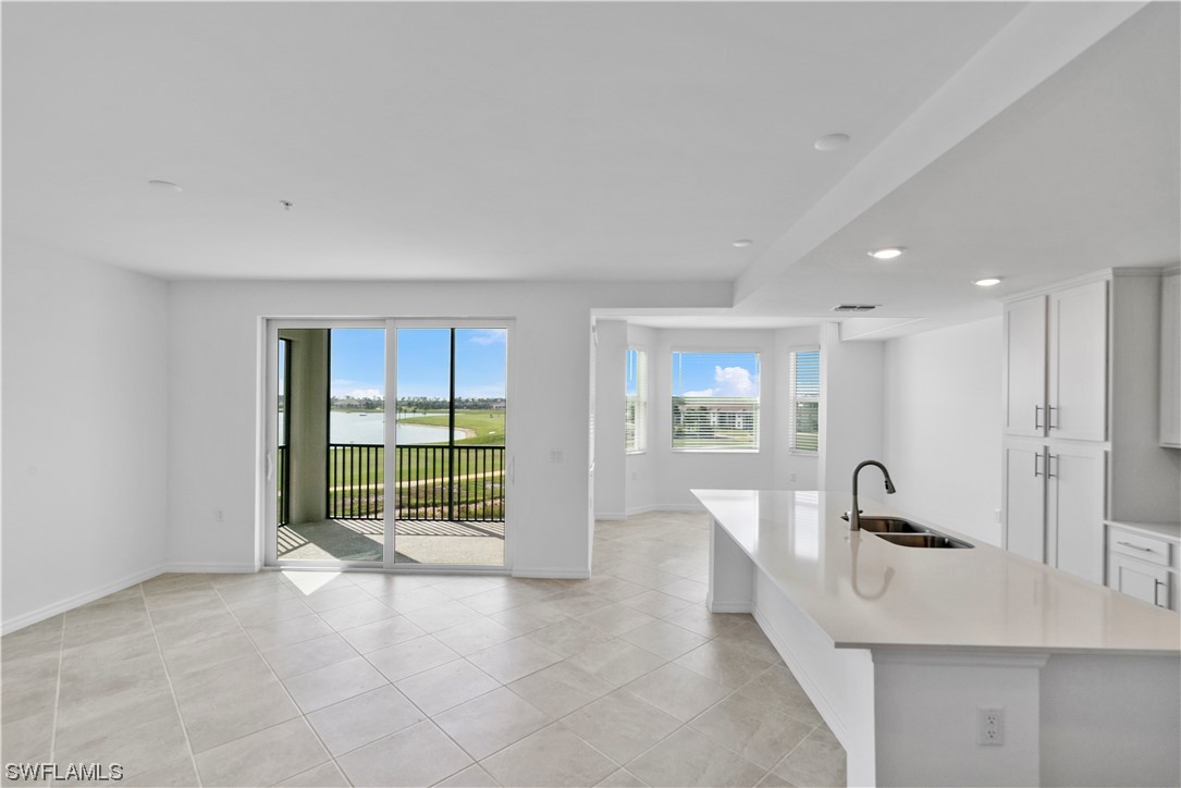 43989 Boardwalk Loop, Unit 2033 Punta Gorda, FL 33982 - Photo 21 of 36 a view of a room with large windows