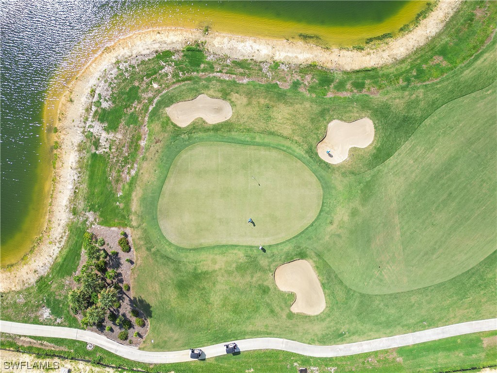 43989 Boardwalk Loop, Unit 2033 Punta Gorda, FL 33982 - Photo 5 of 36 a bathroom with a sink and mirror
