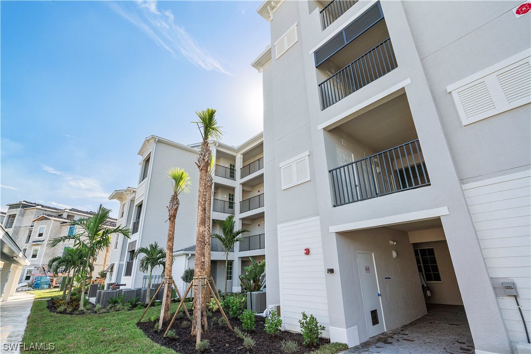 43989 Boardwalk Loop, Unit 2033 Punta Gorda, FL 33982 - Photo 6 of 36 a view of front door and potted plants