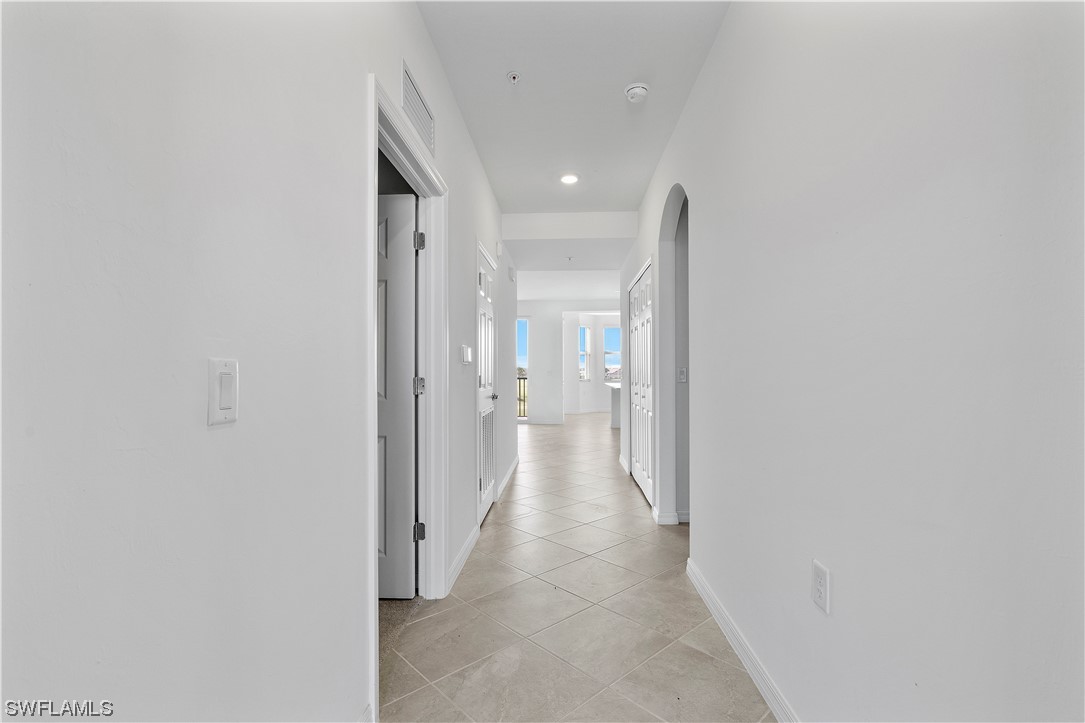43989 Boardwalk Loop, Unit 2033 Punta Gorda, FL 33982 - Photo 8 of 36 a view of a hallway with a room