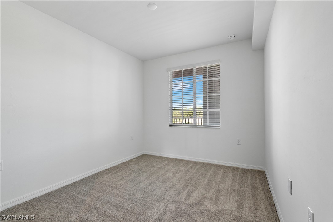 43989 Boardwalk Loop, Unit 2033 Punta Gorda, FL 33982 - Photo 10 of 36 an empty room with a window