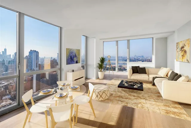 a living room with furniture hard wood floor and a floor to ceiling window