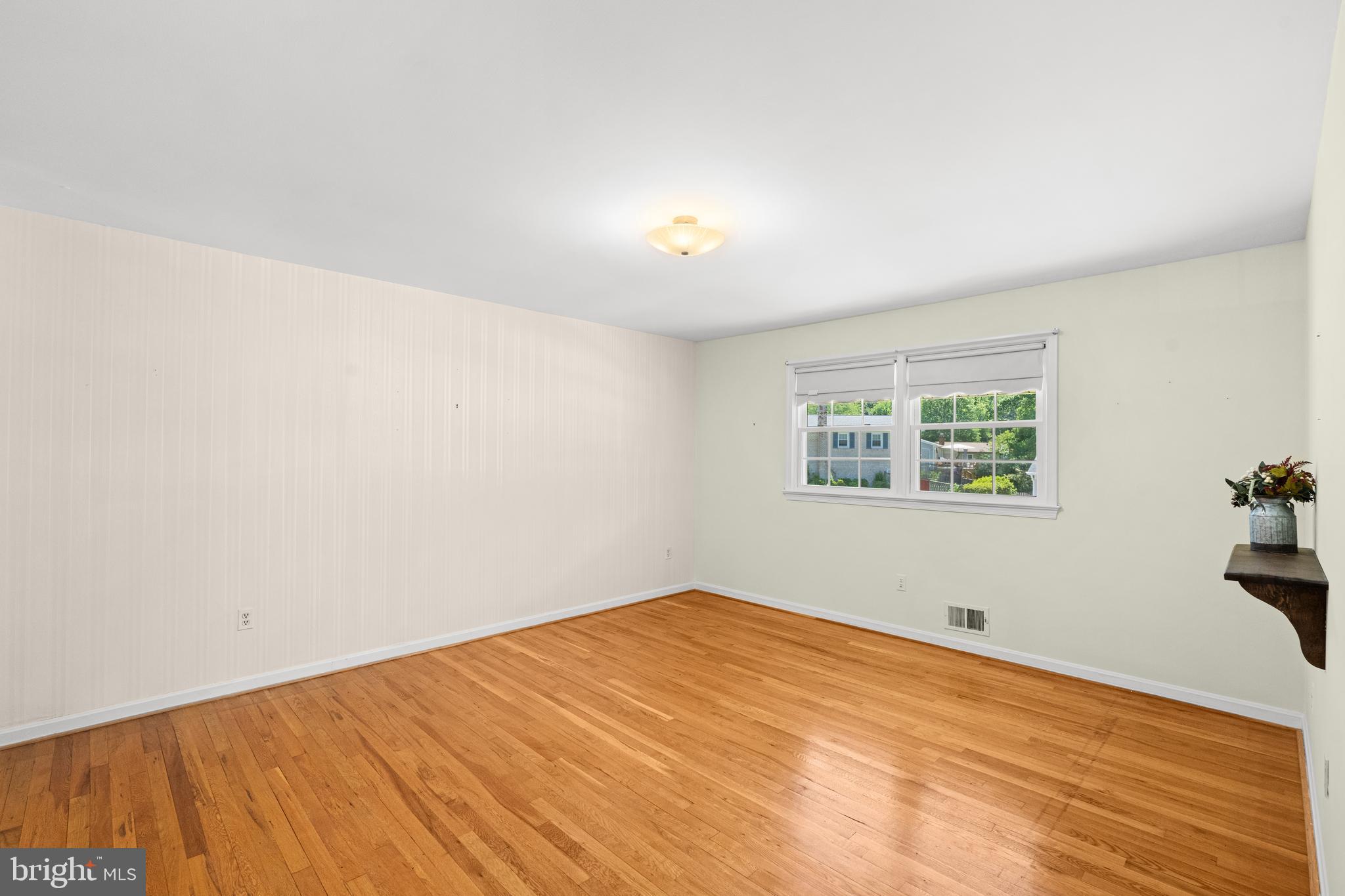 6703 Red Jacket Road Springfield, VA 22152 - Photo 17 of 31 Primary Bedroom accentuates the hardwood floors