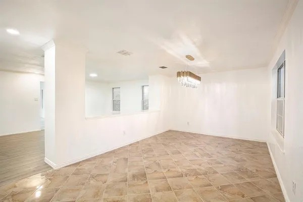 a kitchen with granite countertop a sink stove and cabinets