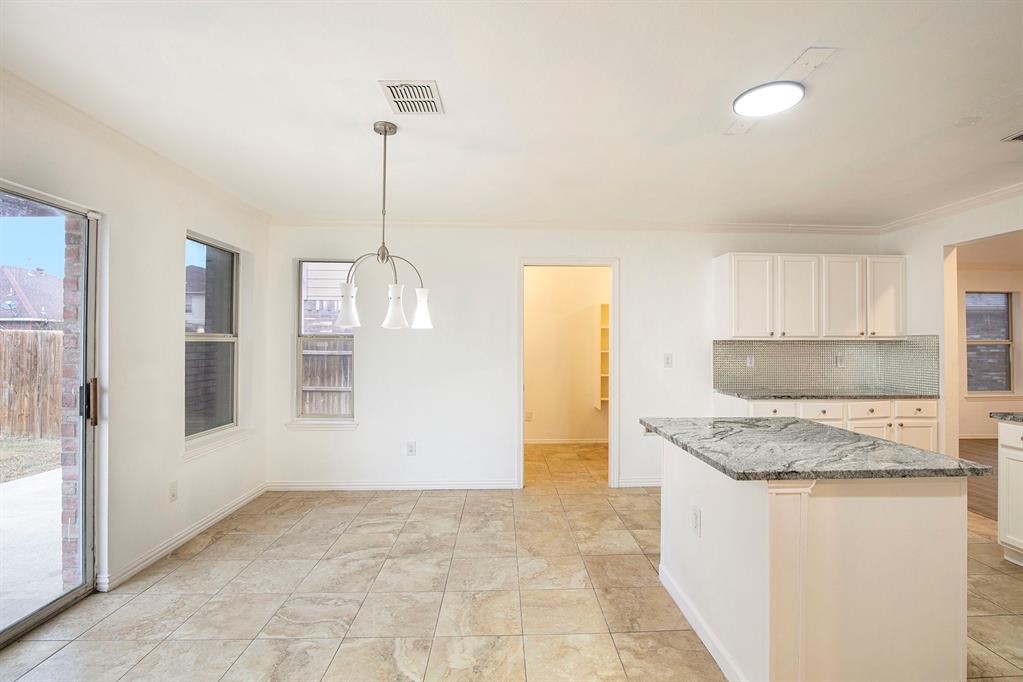 4800 Sleepy Ridge Circle Fort Worth, TX 76133 - Photo 15 of 40 a kitchen with a granite countertop sink and a granite counter tops