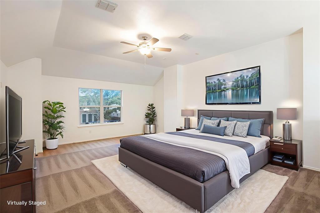 4800 Sleepy Ridge Circle Fort Worth, TX 76133 - Photo 18 of 40 a spacious bedroom with a large bed and a chandelier