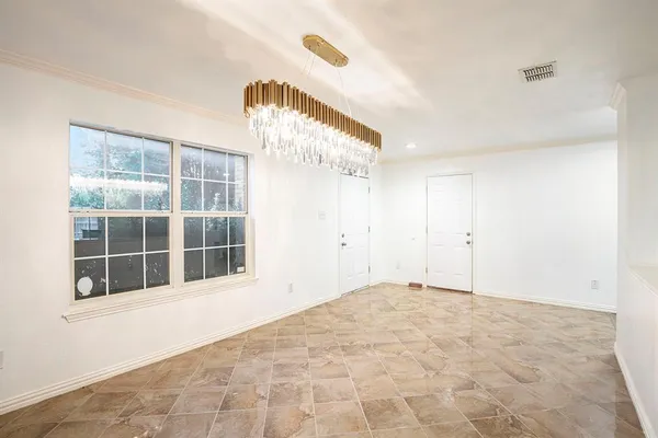 a view of empty room with windows